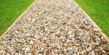 Gravel,Walking,Path,In,A,Green,Grass,Field,For,Background