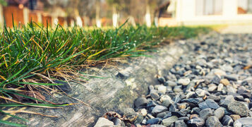 Wood,Piece,Is,Separating,The,Aggregate,And,The,Grass,In