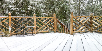 Empty,Wooden,Deck,Of,House,With,Statue,Decorations,,Chairs,,Staircase