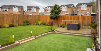 A,Modern,Garden,With,A,New,Planted,Lawn,Decking,Shrubs