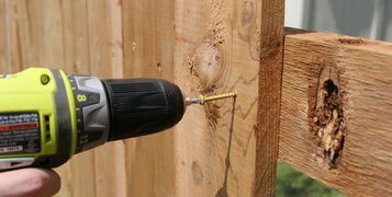 Building,A,Wooden,Fence,With,A,Drill,And,Screw