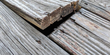 Wooden,Deck,Floor,Boards,Coming,Up,That,Are,Old,,Warped